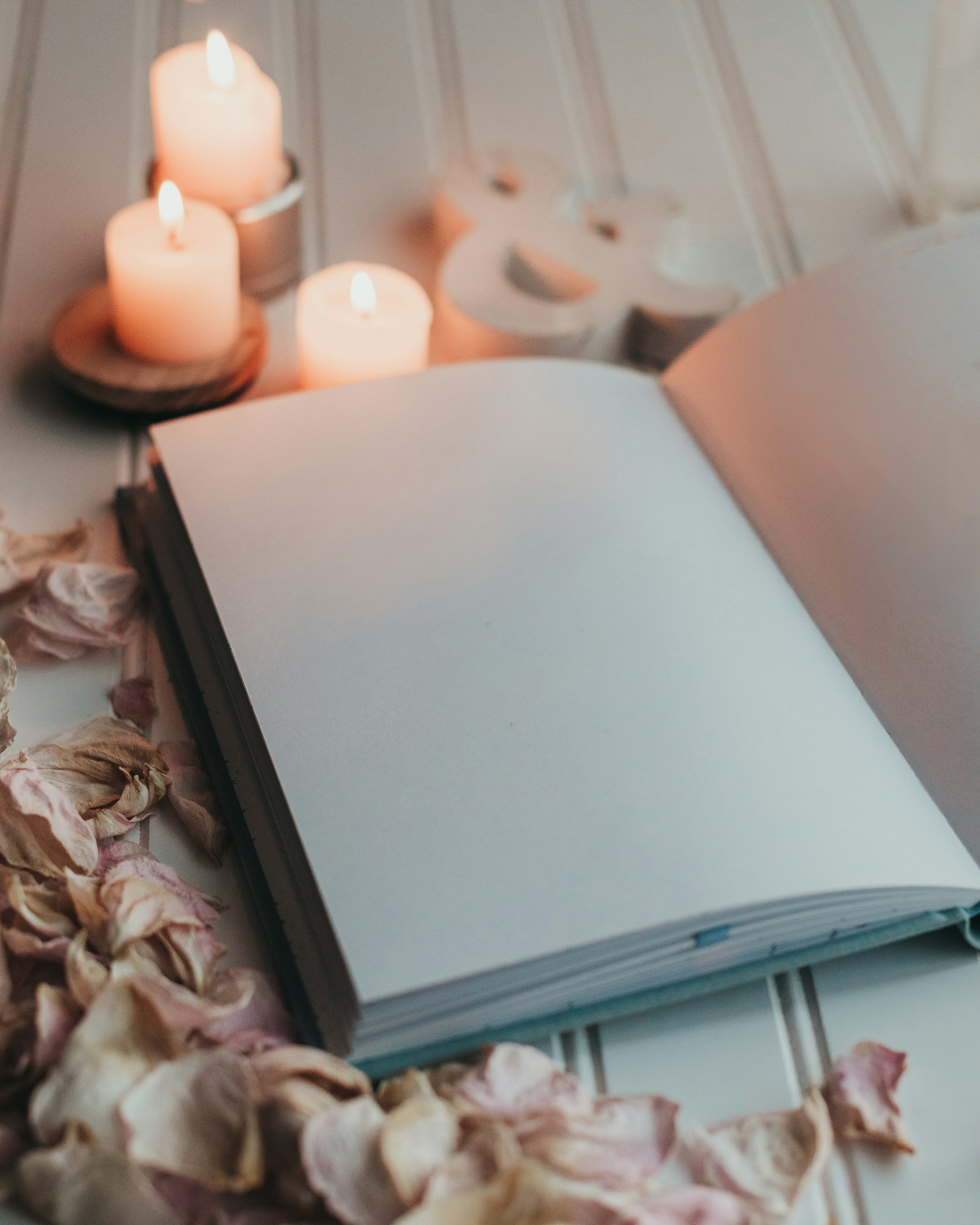 A candlelit book photograph chosen as reading atmosphere; it does not depict a specific title or review.